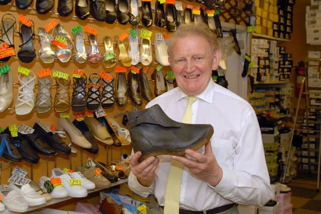Jarlath McConville in his North Street shop with an old clog which were made in Lurgan over 50 years ago. LM30-100gc