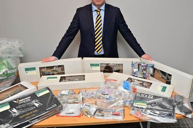Detective Chief Inspector Richard Thornton of PSNI Organised Crime Team with some Items that have been seized following significant pre-planned search operation in Potadown.  Picture: Colm Lenaghan/Pacemaker