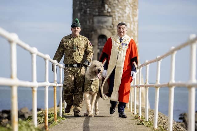 Mayor of Mid and East Antrim, Alderman Noel Williams with military personnel.