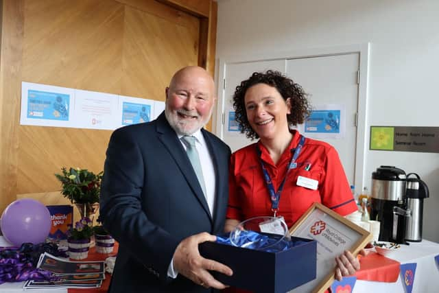 Hazel’s husband, John McCalister with Interim Team Lead, Lisa Crothers being presented with her award