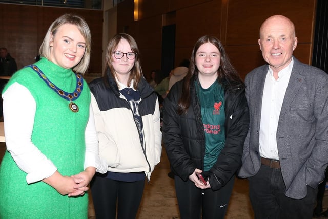 Councillor Kathleen McGurk, Deputy Mayor of Causeway Coast and Glens Borough Council, pictured with Councillor Sean McGlinchey, Nicole McGlinchey and Enya McCuske and some of those who attended the Irish Language Week celebration in Cloonavin.