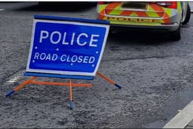 PSNI police sign road closed