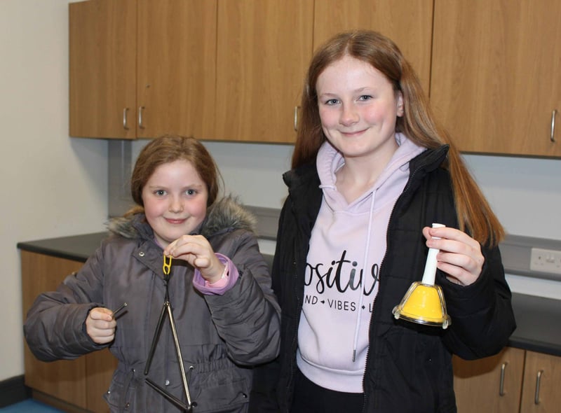 Friends Eva and Emily from St. Aloysius making some noise in Music