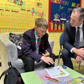 Education Minister Paul Givan in conversation with a pupil during his visit to Carrickfergus Academy.