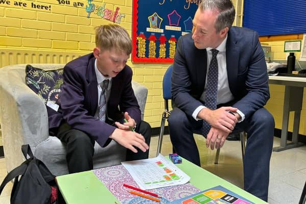 Education Minister Paul Givan in conversation with a pupil during his visit to Carrickfergus Academy.