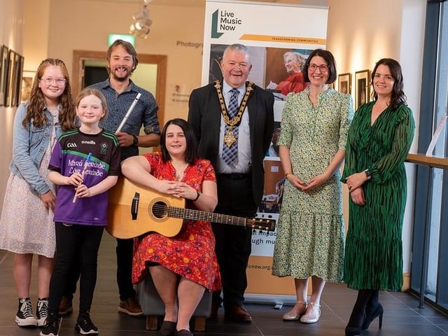 L-R Young Musicians from Comhaltas Ceoltóirí Éireann with Conor Lamb and Deirdre Galway, Réalta, Mayor, Councillor Ivor Wallace, Alice Lewis National Director LMN NI and Shirleen McCann Bank of Ireland