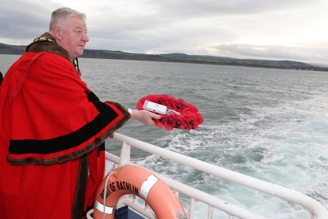 Mayor Steven Callaghan lays a wreath at sea on his way to Rathlin Island remembrance service