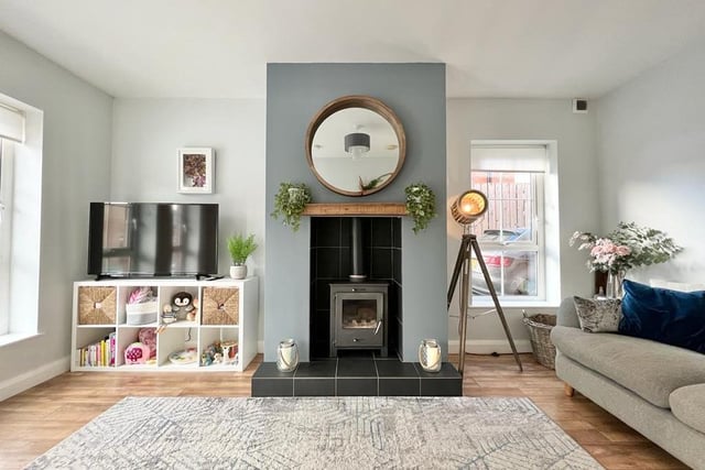 The living room has a wood burning stove - perfect for for cosy nights in.