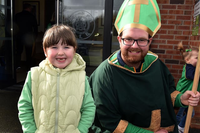 Jessica McConville (6) poses proudly with St Patrick who was played by Canice McShane for the St Paul's GAC parade. LM12-203.