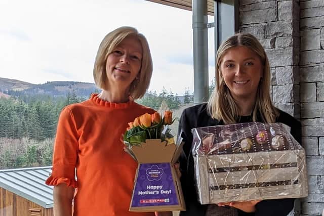 Mary McConnell is presented with her hamper and flowers by Claire Murphy from Henderson Group who thanked her for all she does for Cancer Fund for Children ahead of Mother’s Day