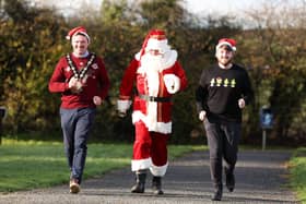 The Mayor of Lisburn & Castlereagh City Council, Councillor Scott Carson and Councillor Aaron McIntyre, Chair of the Leisure & Community Development Committee are joined by Santa Claus to launch the 2022 Santa Dash at Lough Moss Leisure Centre, Carryduff