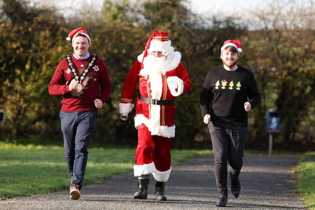 The Mayor of Lisburn & Castlereagh City Council, Councillor Scott Carson and Councillor Aaron McIntyre, Chair of the Leisure & Community Development Committee are joined by Santa Claus to launch the 2022 Santa Dash at Lough Moss Leisure Centre, Carryduff
