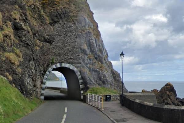 You'd be hard pressed to find a more scenic driving route than the Antrim Coast Road, with its sea views on one side and rugged hillsides and cliffs on the other.  The Black Arch at Larne was one of the many features devised in the 19th century by the road's designer and creator, Scottish engineer William Bald.