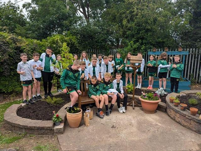 St Patrick’s Primary School P7 leavers carry out a legacy garden makeover as gift to Lurgan school