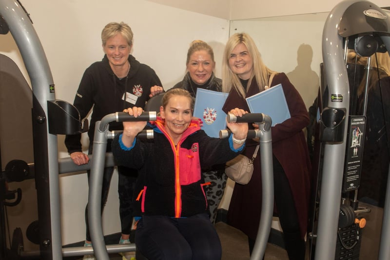 Trying out the gym equipment on open night.