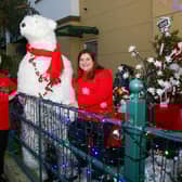Clara and Cathy Smyth with 'Tucker' the polar bear at the Christmas garden near Carrick Marine.  Photo: Jackie Henry