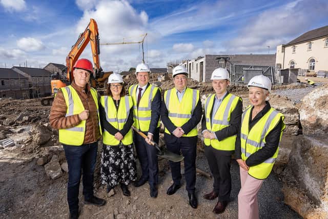 Communities Minister Gordon Lyons visits the ongoing works at the Commercial Road in Banbridge, where 59 new homes are under construction.