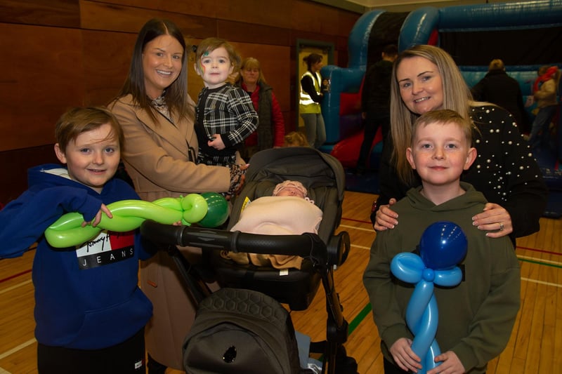 Pictured at the St Patrick's fun day in St Mary's Youth Club on Saturday are from left, Harry Magill (9), Mary-Beth McWilliams, Teddie McWilliams (2), Marley McWilliams (5 weeks), Seanna Magill and Toby MUrphy (8). PT11-228.