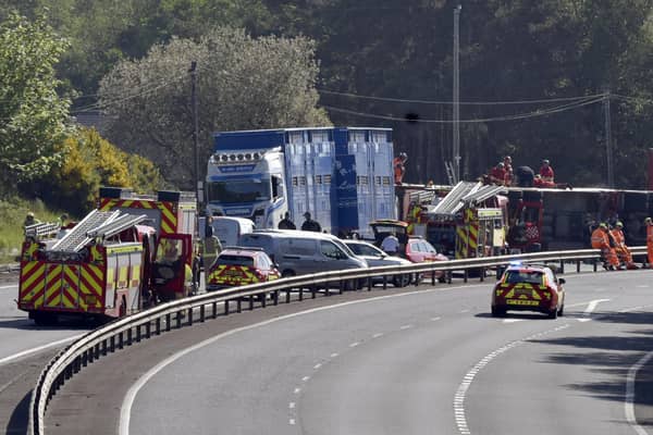 Emergency services at the scene of the overturned livestock lorry on the M1. Picture: Pacemaker