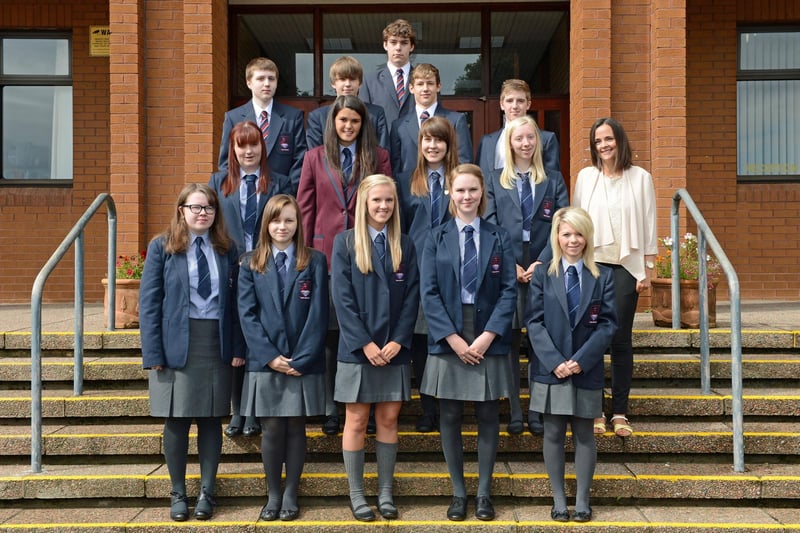 Larne Grammar School students who achieved at least 8 GCSEs at grade A or better in 2012.  They are pictured with Year 12 head teacher, Miss Weir. INLT 35-003-PSB