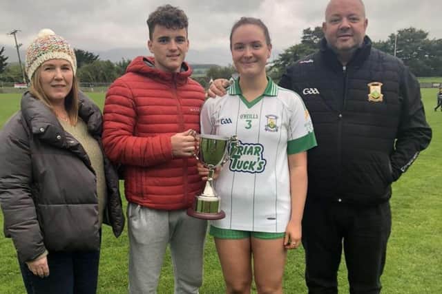 Caoimhe pictured with her family during her playing days for St Mary’s Burren GAA.