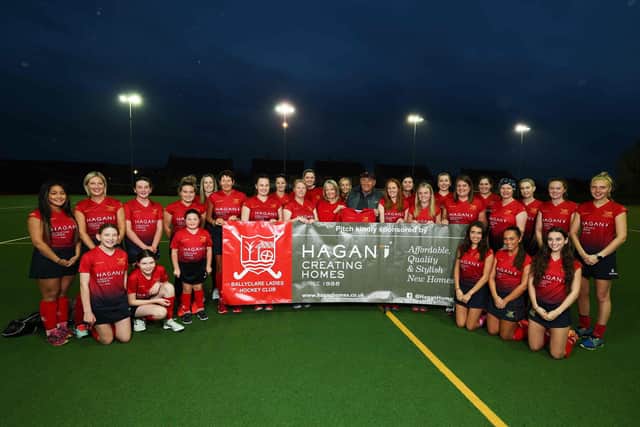 James Hagan with members of Ballyclare Ladies Hockey Club. Picture by Kelvin Boyes  // Press Eye.