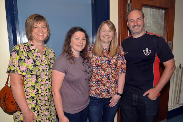 Lurgan College Chemistry teacher, John Finlay pictured with three of his former pupils, Victoria Parks, Tracey Turkington and Zoe McWilliams who attended the College 150th anniversary open morning on Saturday. LM25-222.