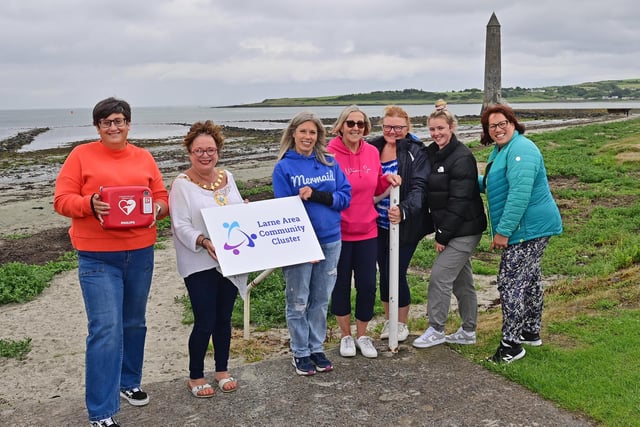 Members of EMBRACE Outdoor Swimming Group, who are based at Ballygally, with the Mayor, Ald Gerardine Mulvenna.