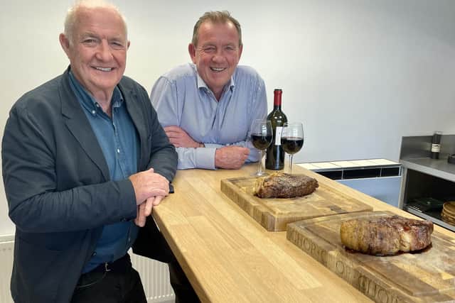 Enjoying one of the classic Hannan Delmonico steaks is distinguished chef Rick Stein, left, with Peter Hannan, the founder and manager of Hannan Meats in Moira.