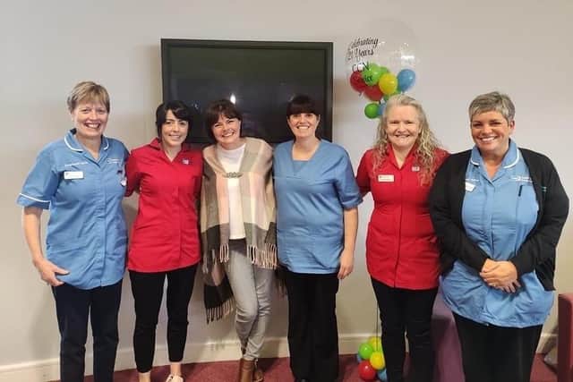 Portadown mum Julie Flaherty with members of the Children's Community Nursing Team in the Southern Health and Social Care Trust who were involved in the care of her son Jake.