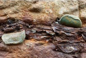 The World Heritage Site is being damaged by coins being hammered by visitors into the cracks and joints. CREDIT NATIONAL TRUST
