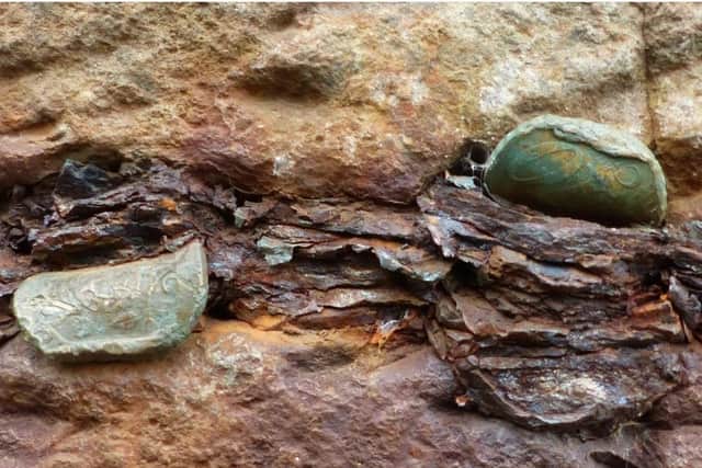 The World Heritage Site is being damaged by coins being hammered by visitors into the cracks and joints. CREDIT NATIONAL TRUST