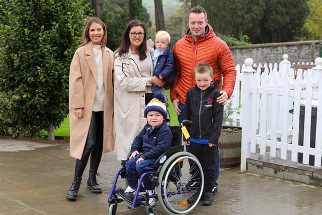 Anna Corry of Blossomingbirds is pictured with Andrene and Graham Rennie of The Big C Foundation, sons Zak (age 1) and Lewis (age 6), and Jack McClenaghan (age 3) as the families join forces to drive a fundraising campaign to purchase wheelchairs to help children living with cancer. The initiative is in honour of Andrene and Graham’s son Callum (age 3) who passed away in May. 
 