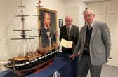 Councillor Thomas Beckett, Chair of LCCC’s Communities and Wellbeing and Lisburn-based modeller, Werner Geyer at the exhibition. Pic credit: LCCC