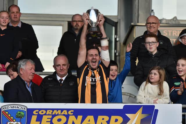 Crossmaglen captain Jamie Clarke lifts the cup