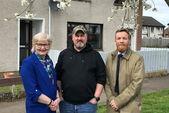 Tenant John McCloskey, from Ballysally, discusses the successful Girona Project, which provides cheaper electricity, with Mark Alexander, Housing Executive Area Manager for the Causeway, and Patch Manager Evelyn Conn. Credit: Housing Executive