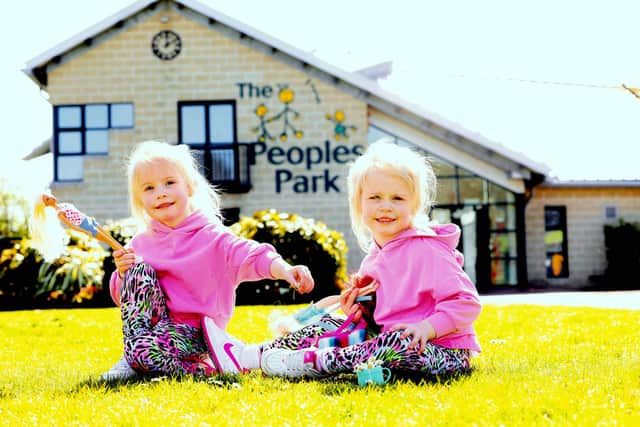 Four-year-old twins Caoimhe and Caitlin McErlean from Portglenone in Co Antrim enjoy a day out in the sunshine at the People’s Park, Ballymena. Picture: Stephen Davison/Pacemaker Press