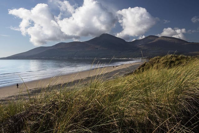 Overlooking this 6km beach stretch are the Mourne Mountains creating quite the view from the sea. Here, the waters are clear creating a beautiful experience all around. To truly enjoy the swim spots Northern Ireland has to offer head to Murlough Beach for its incredible views. This spot is especially popular in the summer months.To find more information go to https://discovernorthernireland.com