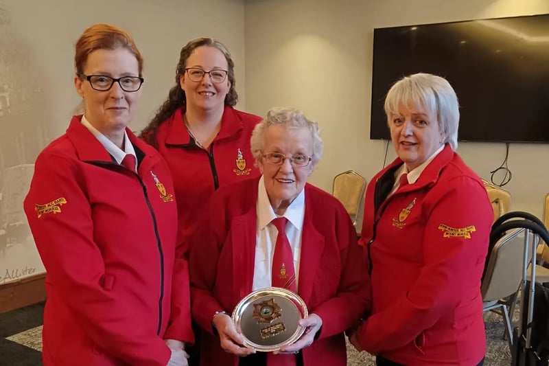 John Hunter's oldest member, Betty Stewart, was presented with an Order of Merit award in recognition of her 71 years in the band.