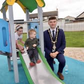 Mayor of Causeway Coast and Glens Councillor Ciarán McQuillan meeting local children at the launch of the new play park at Dromore Avenue in Limavady, which was created with support from the Green Spaces Programme.