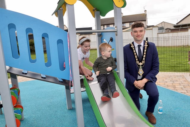Mayor of Causeway Coast and Glens Councillor Ciarán McQuillan meeting local children at the launch of the new play park at Dromore Avenue in Limavady, which was created with support from the Green Spaces Programme.