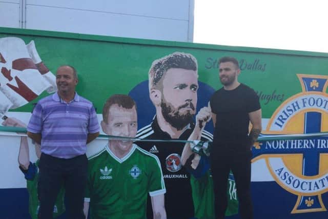 Raymond McCoy and Stuart Dallas pictured standing beside the mural in Cookstown which was unveiled in their honour in the summer of 2019. Credit: National World