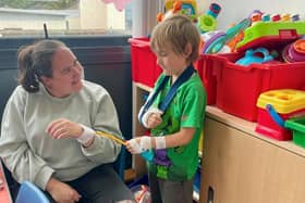 Leanne Curran and son Antsey take some time out in the newly reopened playroom. Pic credit: SEHSCT