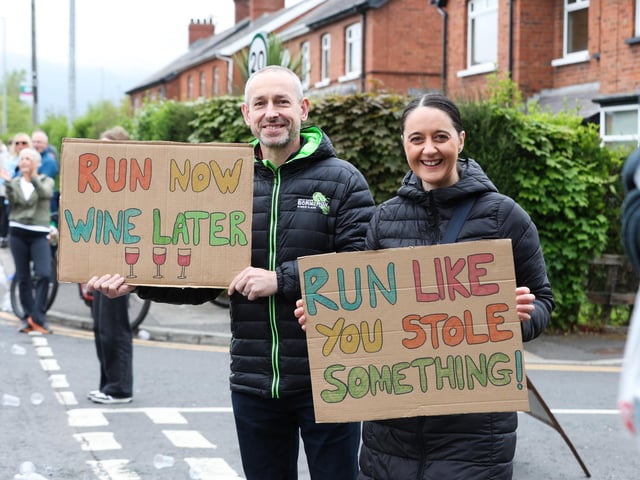 Supporters cheer on the runners along the route.