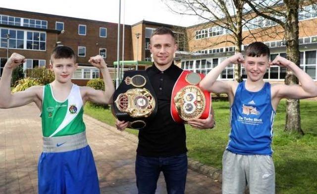 Carl Frampton is a former professional boxer from north Belfast who competed from 2009 to 2021. He is a former two-weight world champion, having held the WBA (Unified) and IBF super-bantamweight titles between 2014 and 2016 and the WBA (Super) featherweight title from 2016 to 2017. Frampton, who attended Glengormley High School, also held the WBO interim featherweight title in 2018. He is pictured with promising boxers at his former school.