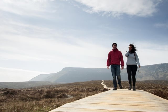 Aptly nicknamed the Stairway to Heaven, the Cuilcagh Boardwalk trail could end with a couple’s idea of heaven with an idyllic proposal.
The viewing platform on Cuilcagh Mountain offers breathtaking views and a great outlook over the surrounding lowlands for an atmospheric romantic moment.