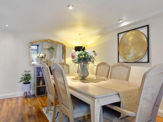 Dining room with glass panelled French doors and glass block feature walls.