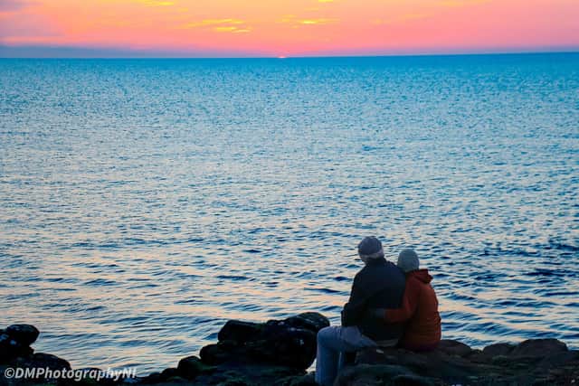 Do you recognise the couple who were captured in this fantastic shot of a stunning Portrush sunset by DMPhotography NI? Credit DMPhotography NI