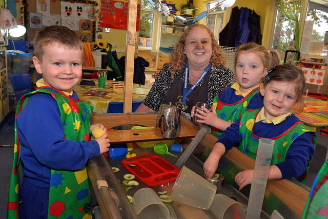 Having fun at the water tray at Edenderry Nursery School  are from left, Seth, Mrs Nicola Wilson, Rose and Ayda. PT43-317.