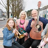 Deputy Lord Mayor of Armagh City, Banbridge and Craigavon Councillor Sorchá McGeown and Ralph McLean, BBC Radio Ulster Presenter pictured with two young buskers.